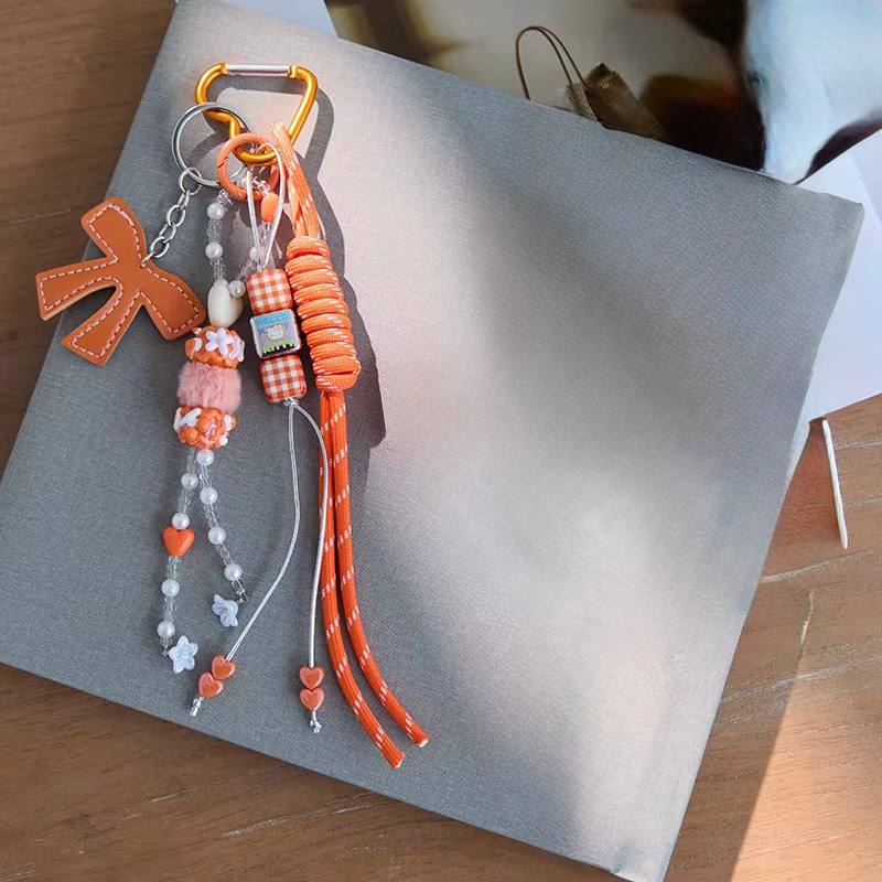 Orange bow bag charm